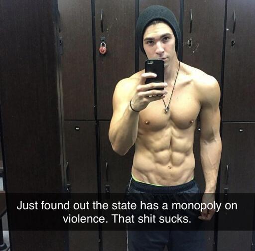 Selfie taken in a locker room. The subject is a muscular man wearing a beanie and gym shorts, a typical gym bro. The text overlay reads: "Just found out the state has a monopoly on violence. That shit sucks."